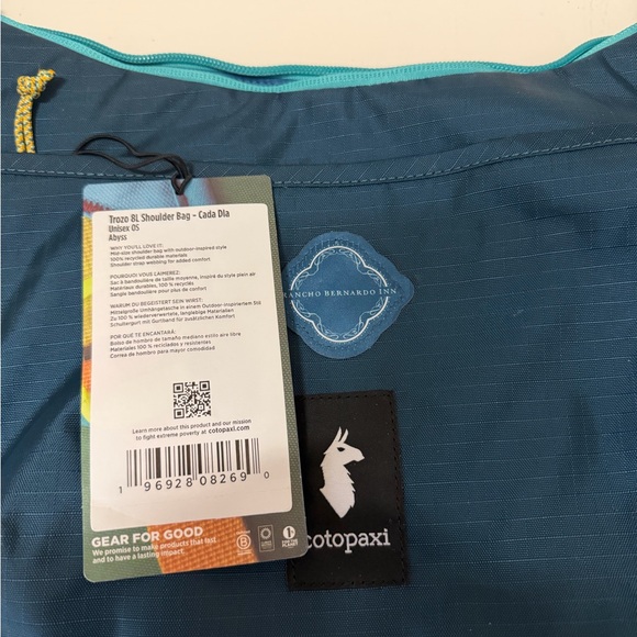 Cotopaxi Navy Crossbody Bag with Teal Accents - Picture 2 of 5